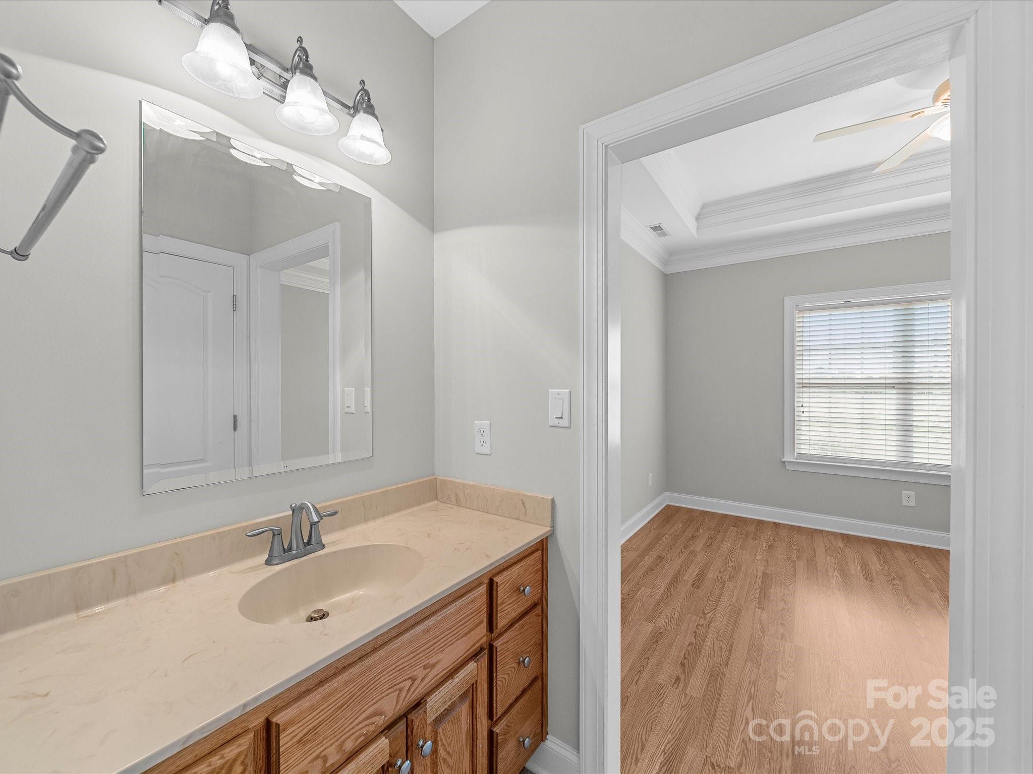 514 Clover Leaf Road Marshville, NC 28103 - Photo 36 of 48 a bathroom with a sink vanity granite tub and a mirror