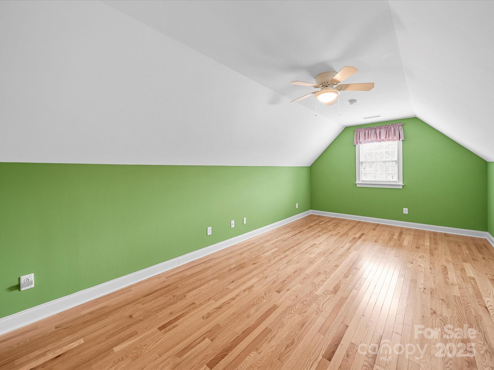 514 Clover Leaf Road Marshville, NC 28103 - Photo 39 of 48 a view of a room with wooden floor and fan
