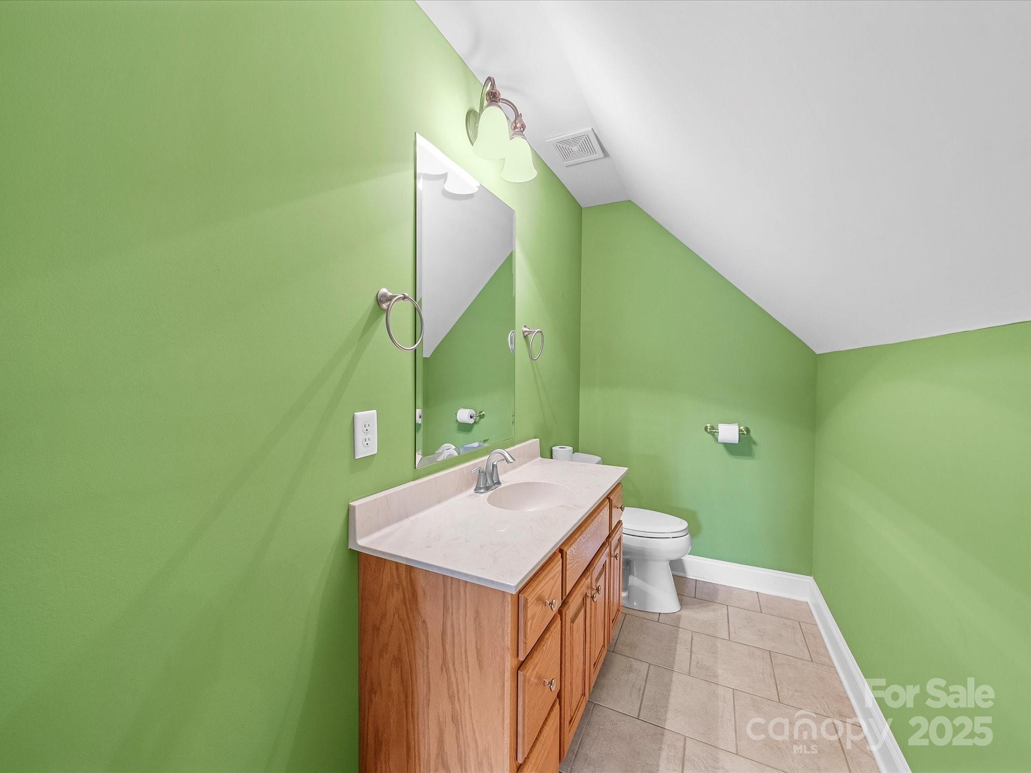 514 Clover Leaf Road Marshville, NC 28103 - Photo 41 of 48 a bathroom with a sink and a mirror