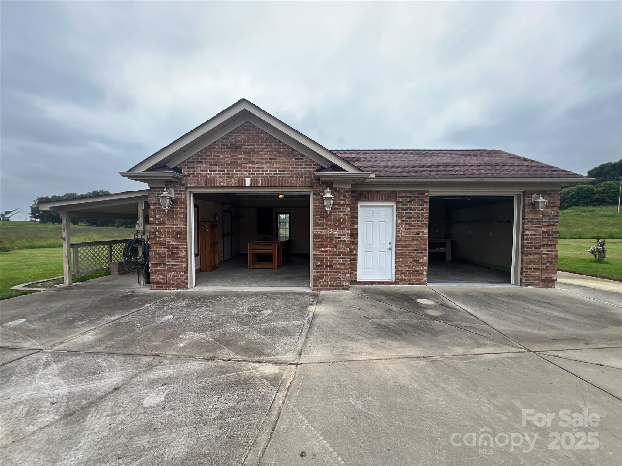 514 Clover Leaf Road Marshville, NC 28103 - Photo 44 of 48 a front view of a house with a garage and a fireplace