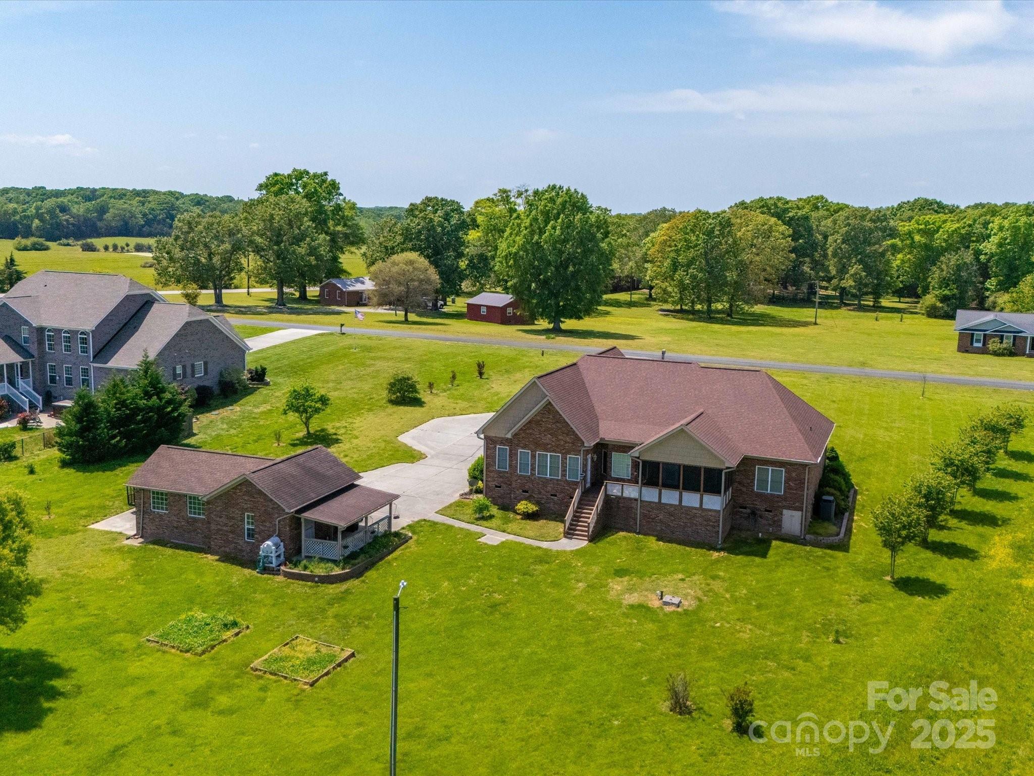 514 Clover Leaf Road Marshville, NC 28103 - Photo 7 of 48 an aerial view of a house with swimming pool and outdoor space