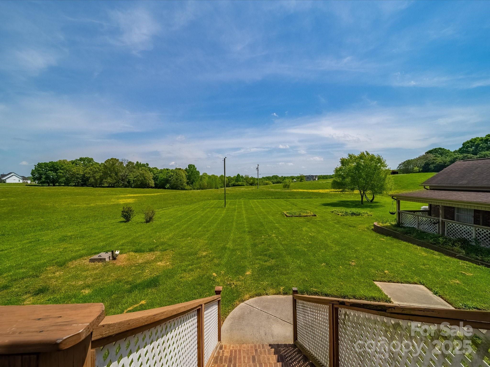 514 Clover Leaf Road Marshville, NC 28103 - Photo 10 of 48 a view of a big room with a big yard