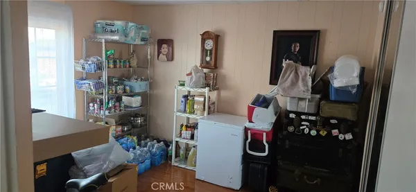 walk in closet with clothes and shoes