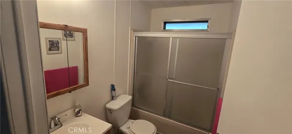 a bathroom with a toilet and a sink