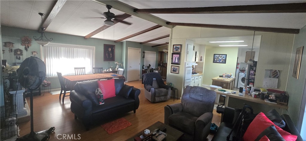 2139 East 4th Street, Unit 13 Ontario, CA 91764 - Photo 15 of 29 a living room with furniture and wooden floor