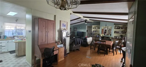 a dining room with furniture and a chandelier