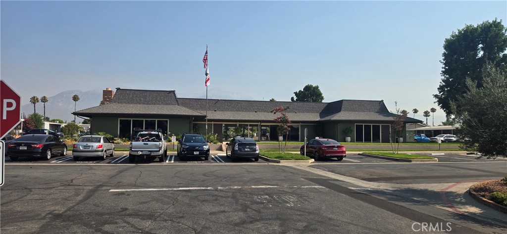 2139 East 4th Street, Unit 13 Ontario, CA 91764 - Photo 21 of 29 a car parked in front of house