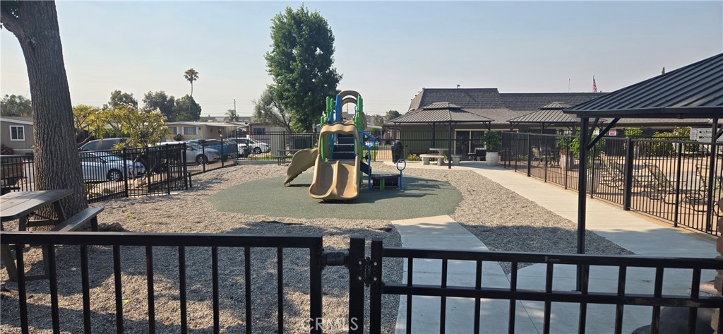 2139 East 4th Street, Unit 13 Ontario, CA 91764 - Photo 22 of 29 a view of a swimming pool with a patio