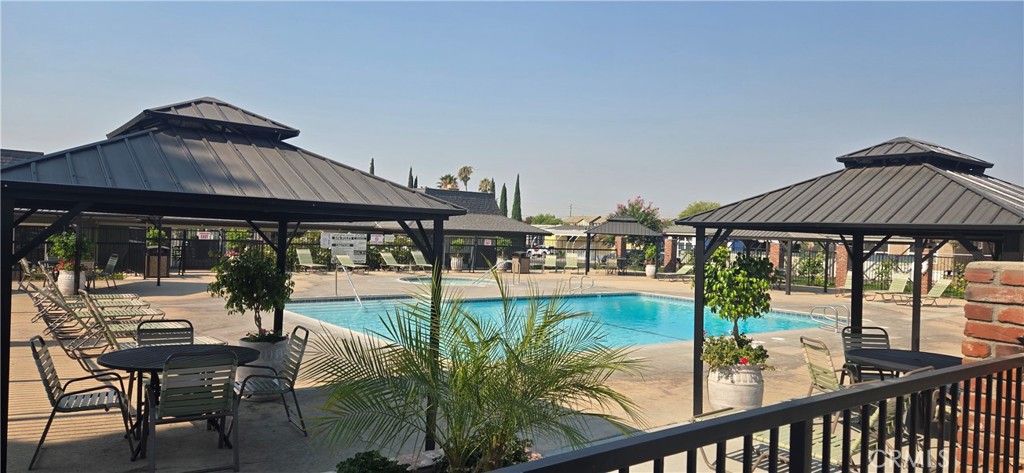 2139 East 4th Street, Unit 13 Ontario, CA 91764 - Photo 23 of 29 swimming pool view with a seating space