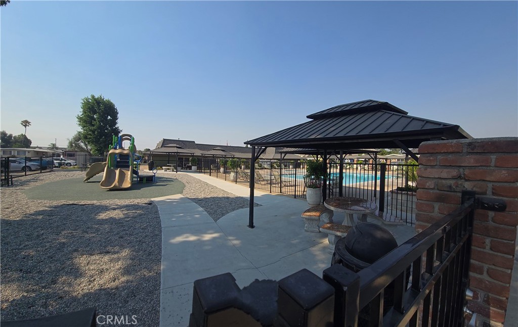 2139 East 4th Street, Unit 13 Ontario, CA 91764 - Photo 27 of 29 a swimming pool with outdoor seating