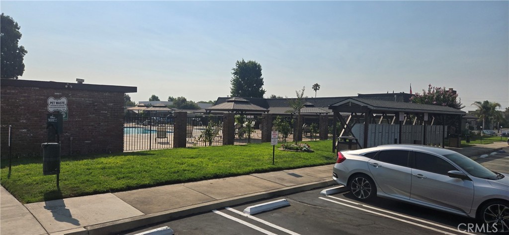 2139 East 4th Street, Unit 13 Ontario, CA 91764 - Photo 28 of 29 a view of a car parked in front of a house