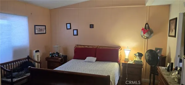a bedroom with a bed and furniture