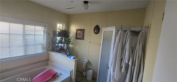a bathroom with a shower and a tub