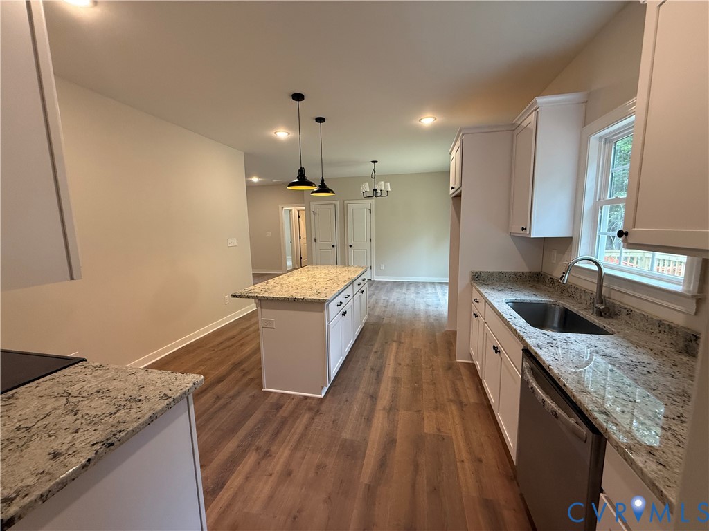 20545 Braxton Road Barhamsville, VA 23011 - Photo 12 of 22 a large kitchen with granite countertop a sink a counter space and stainless steel appliances