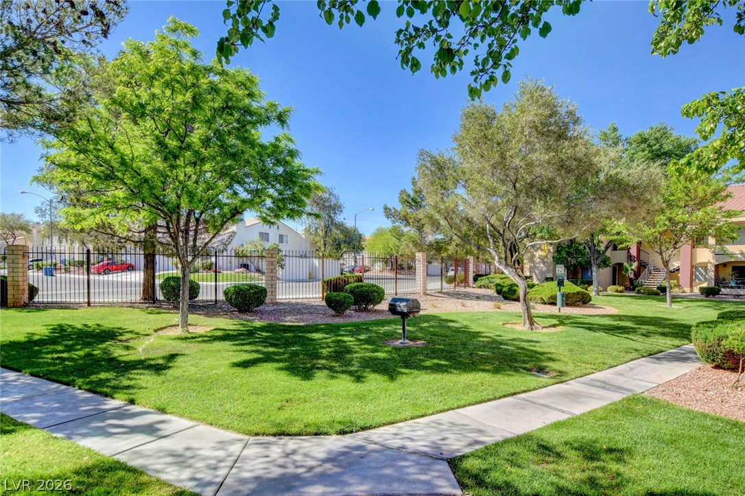 7885 West Flamingo Road, Unit 1050 Las Vegas, NV 89147 - Photo 58 of 62 Manicured green spaces and mature trees surround this welcoming community's outdoor amenities.