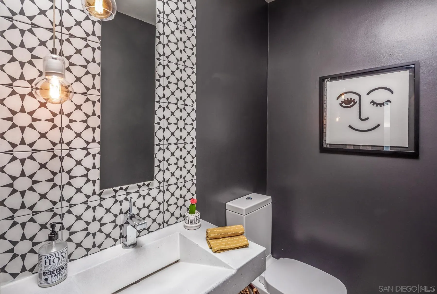 1370 Neptune Avenue Encinitas, CA 92024 - Photo 20 of 52 a bathroom with a toilet and a shower curtain