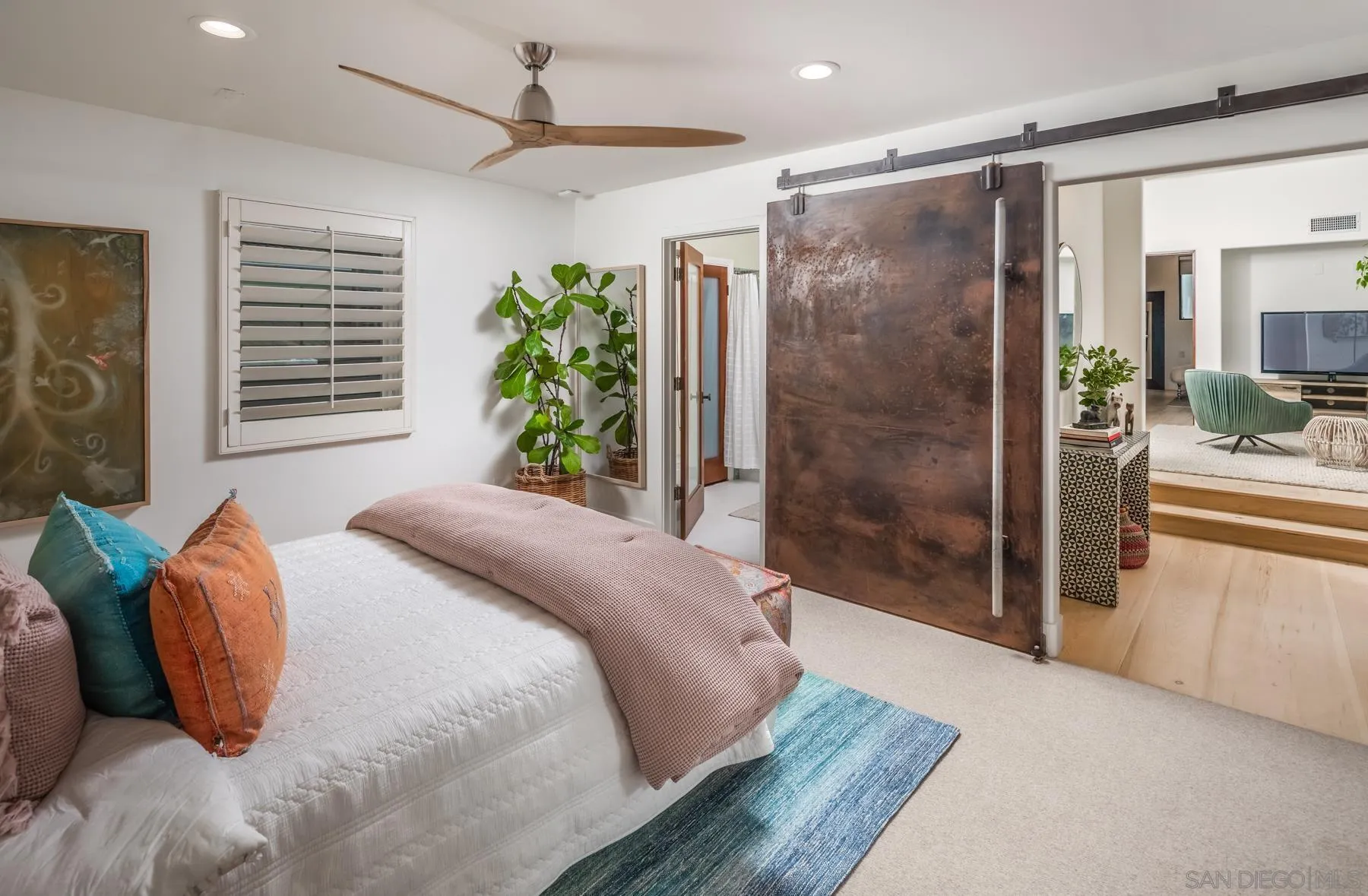 1370 Neptune Avenue Encinitas, CA 92024 - Photo 23 of 52 a bedroom with a bed and a chandelier