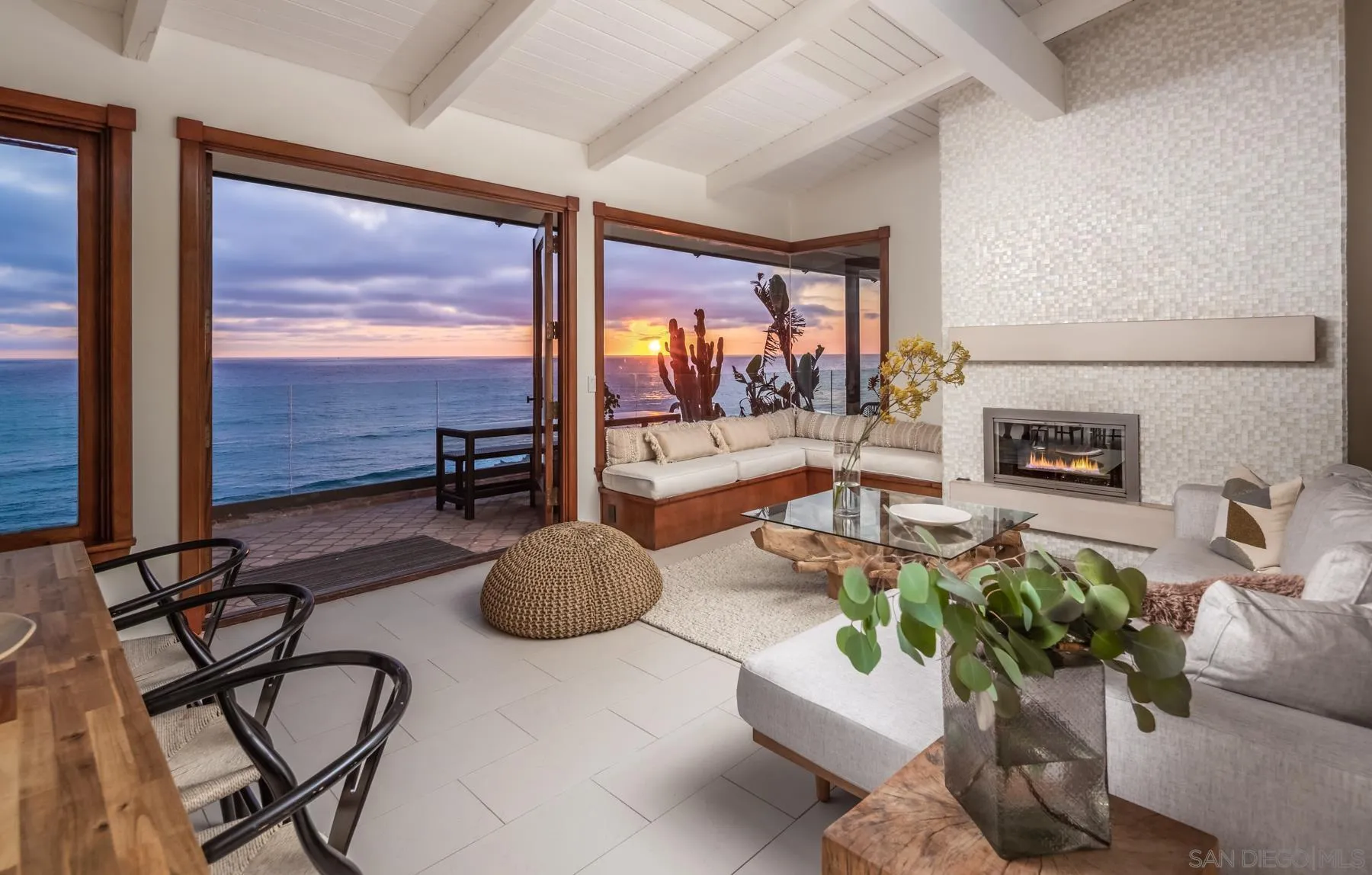 1370 Neptune Avenue Encinitas, CA 92024 - Photo 5 of 52 a living room with fireplace furniture and a floor to ceiling window