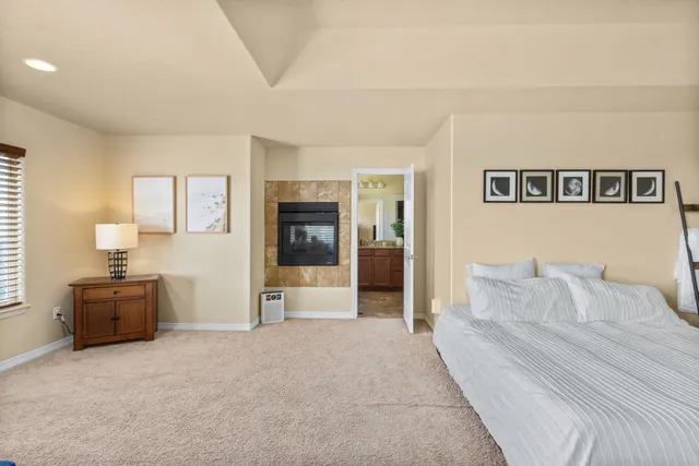 a spacious bedroom with a bed and furniture