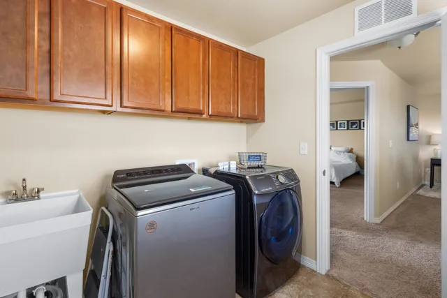 a bedroom with a bed and a baby crib