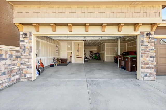 a aerial view of a house with a yard table and chairs