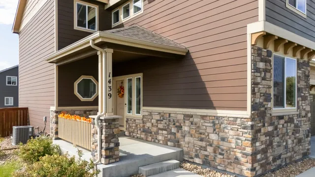 an aerial view of residential houses with outdoor space and swimming pool