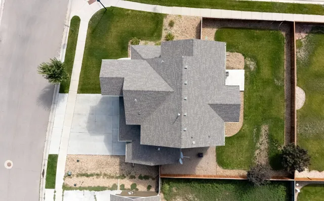 an aerial view of a house with swimming pool