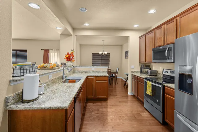 a large kitchen with granite countertop lots of counter top space