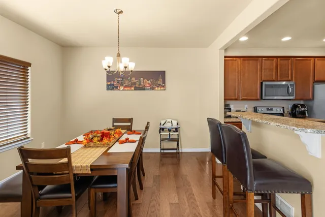 a dining room with furniture and window