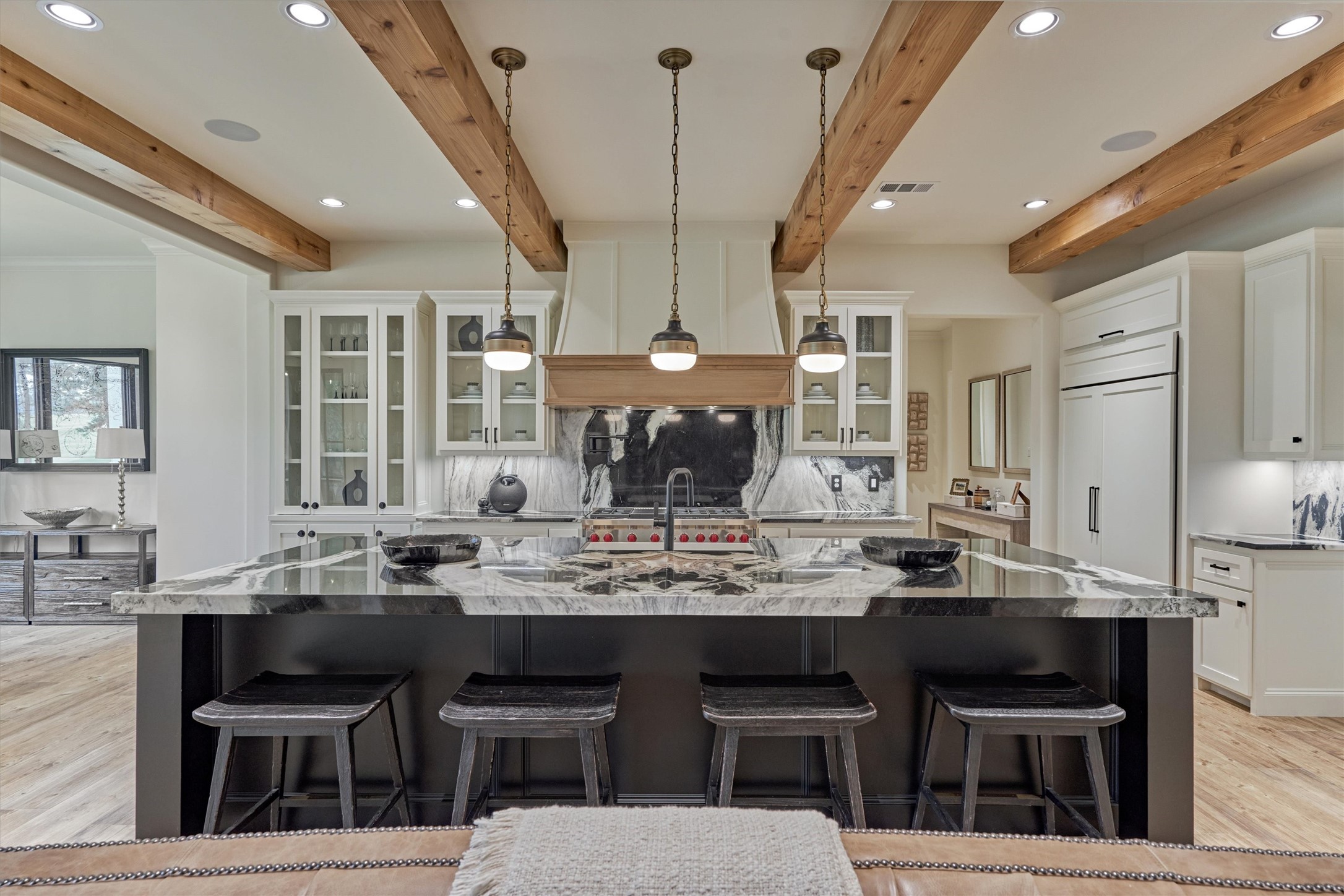 4469 Lily Bean Road Montgomery, TX 77316 - Photo 14 of 50 a kitchen with a dining table chairs cabinets and stainless steel appliances