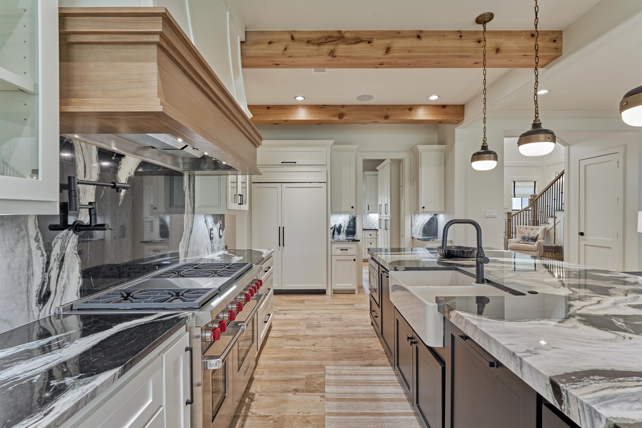 4469 Lily Bean Road Montgomery, TX 77316 - Photo 17 of 50 a kitchen with stainless steel appliances granite countertop a sink and a stove