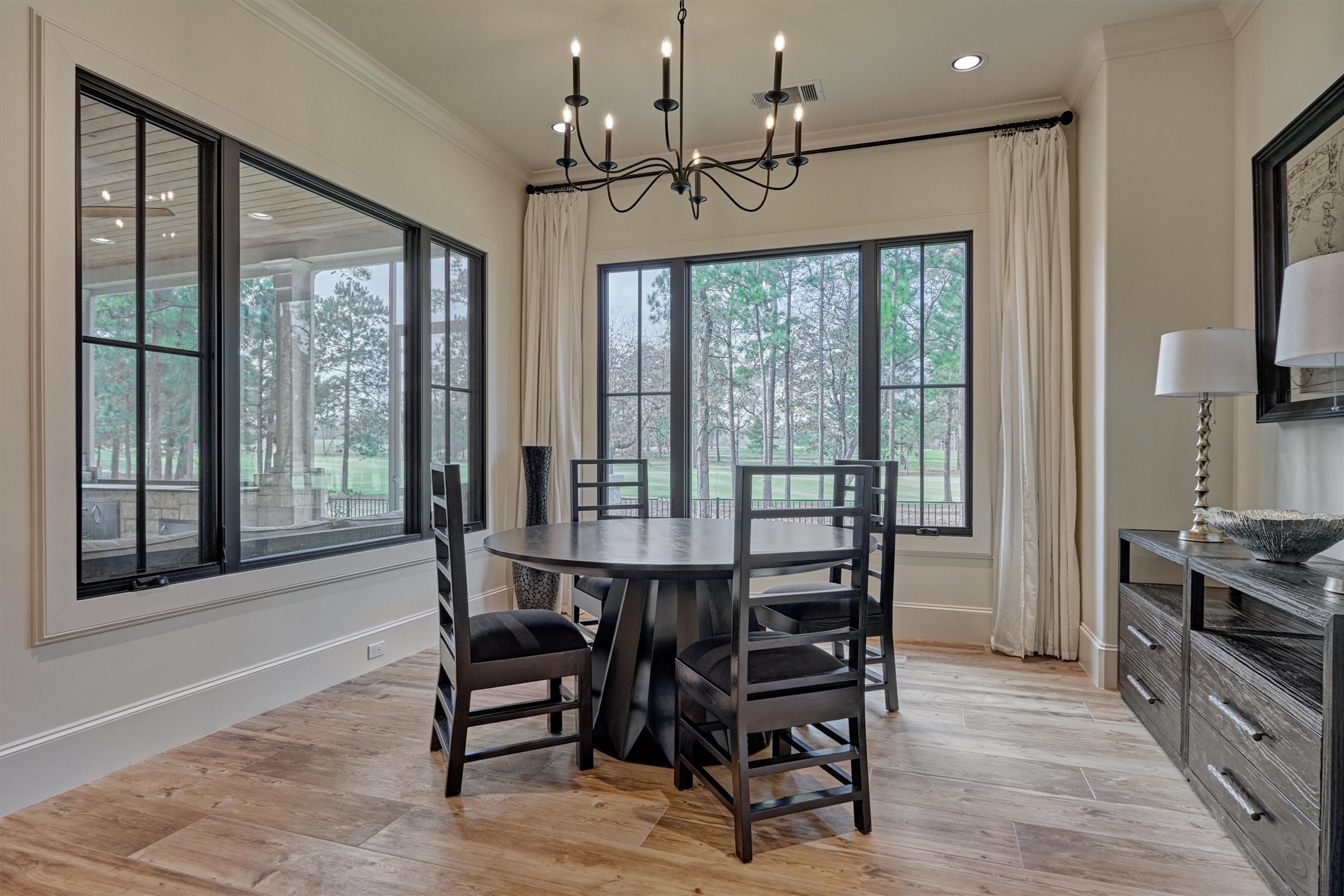 4469 Lily Bean Road Montgomery, TX 77316 - Photo 19 of 50 a view of a dining room with furniture window and wooden floor