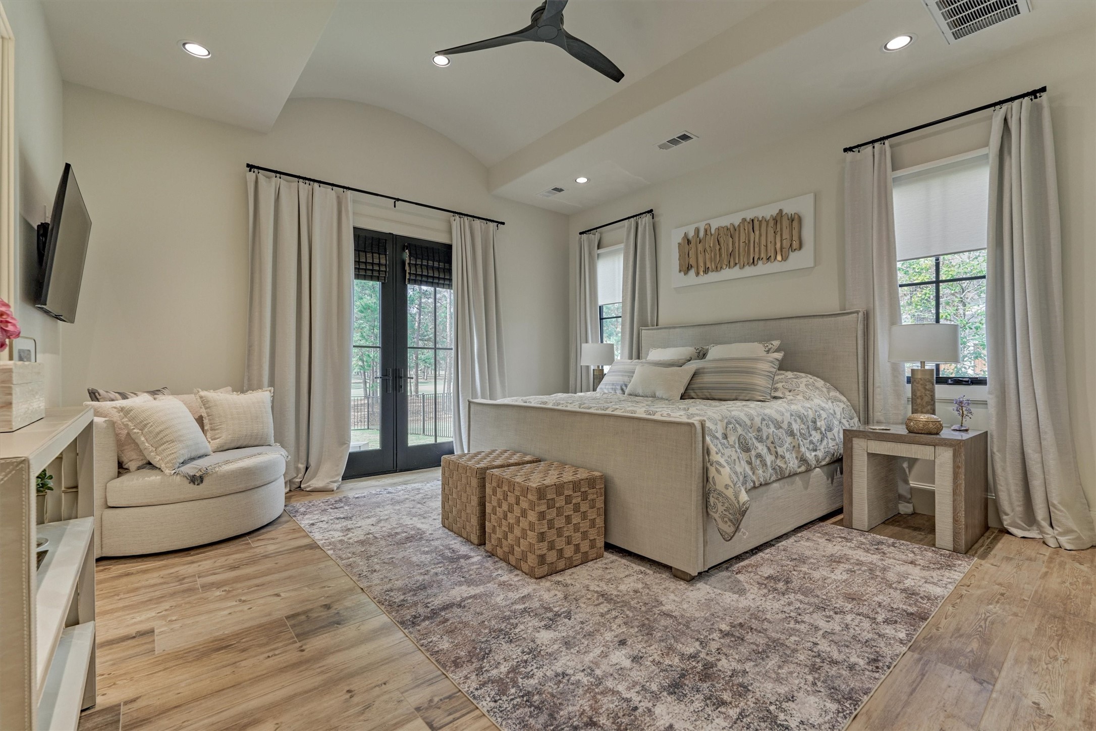 4469 Lily Bean Road Montgomery, TX 77316 - Photo 28 of 50 a bedroom with a large bed and a couch