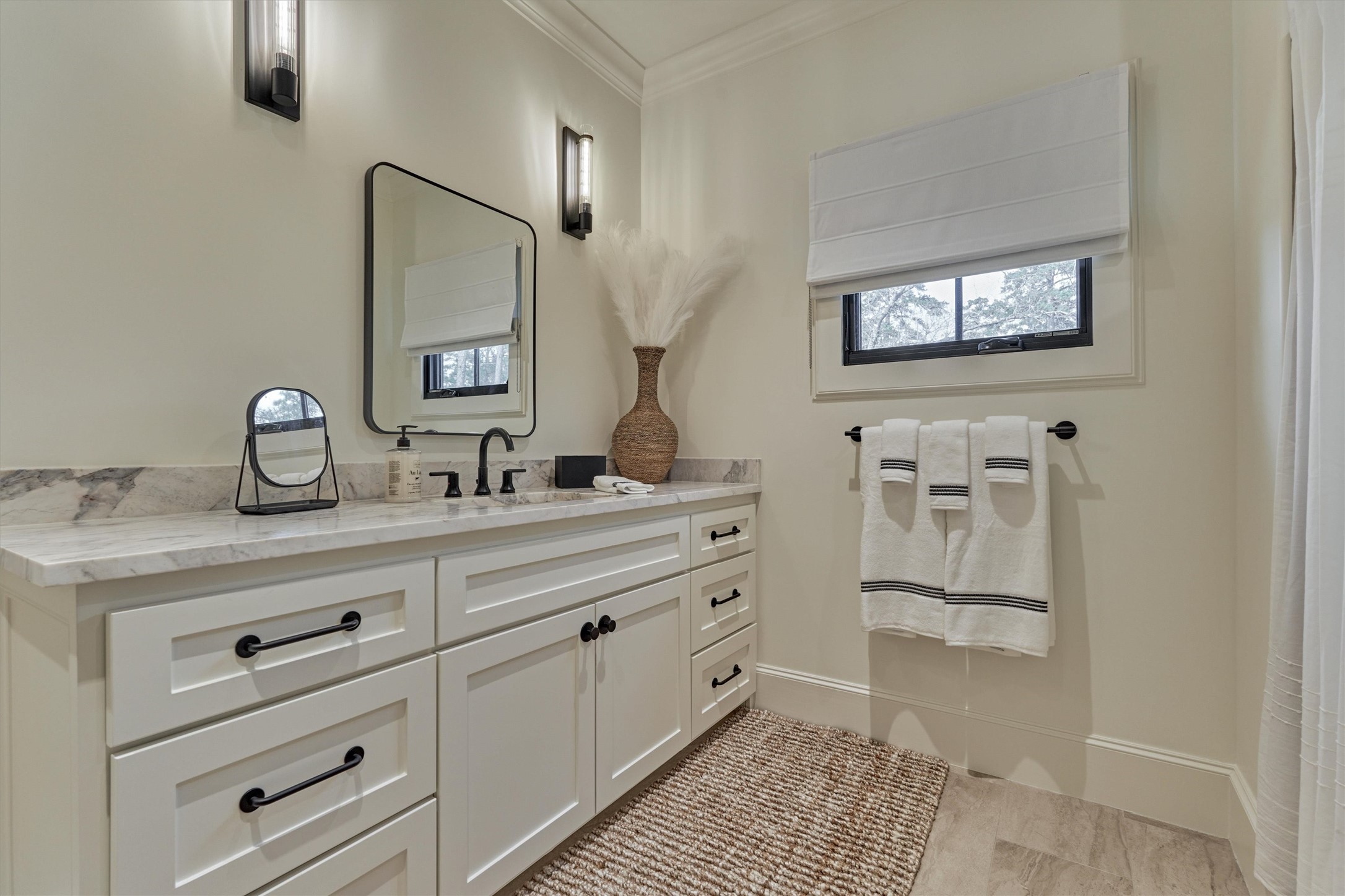 4469 Lily Bean Road Montgomery, TX 77316 - Photo 37 of 50 a spacious bathroom with a granite countertop sink and a mirror