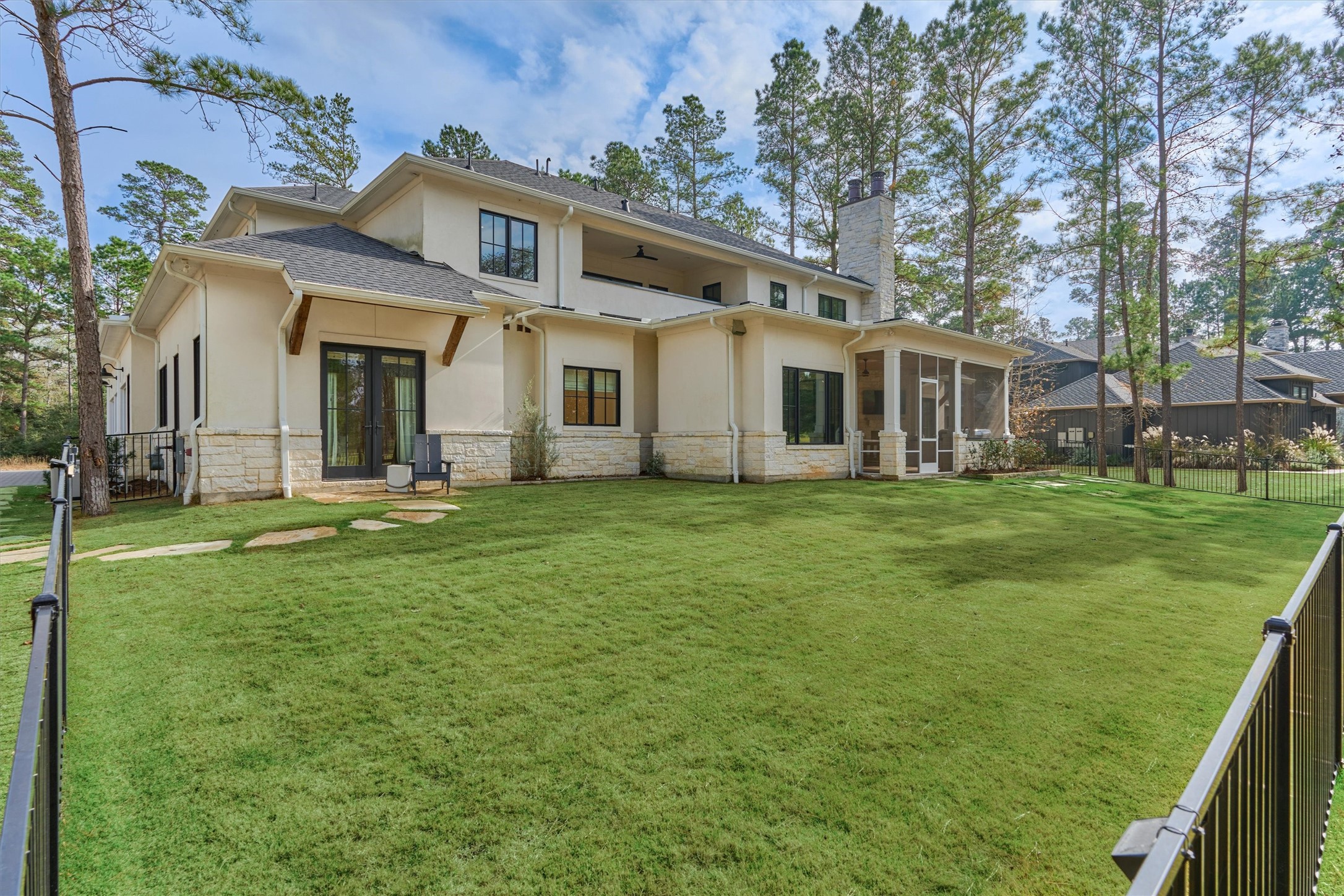 4469 Lily Bean Road Montgomery, TX 77316 - Photo 47 of 50 a front view of a house with a garden and trees