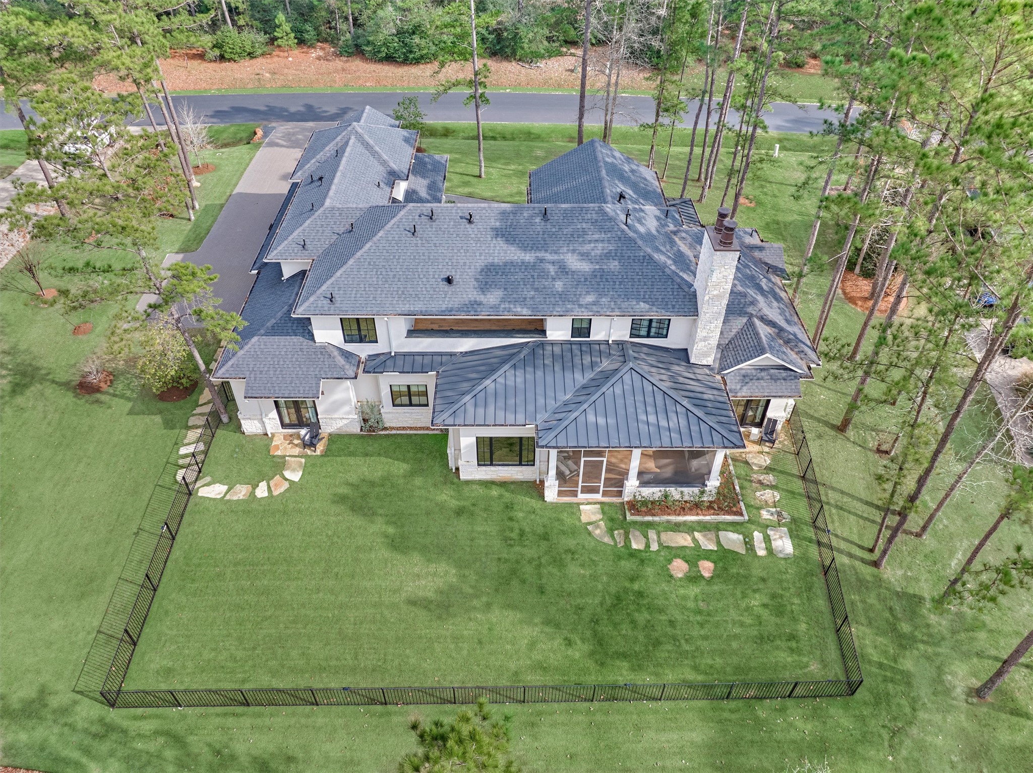 4469 Lily Bean Road Montgomery, TX 77316 - Photo 48 of 50 a aerial view of a house with a garden