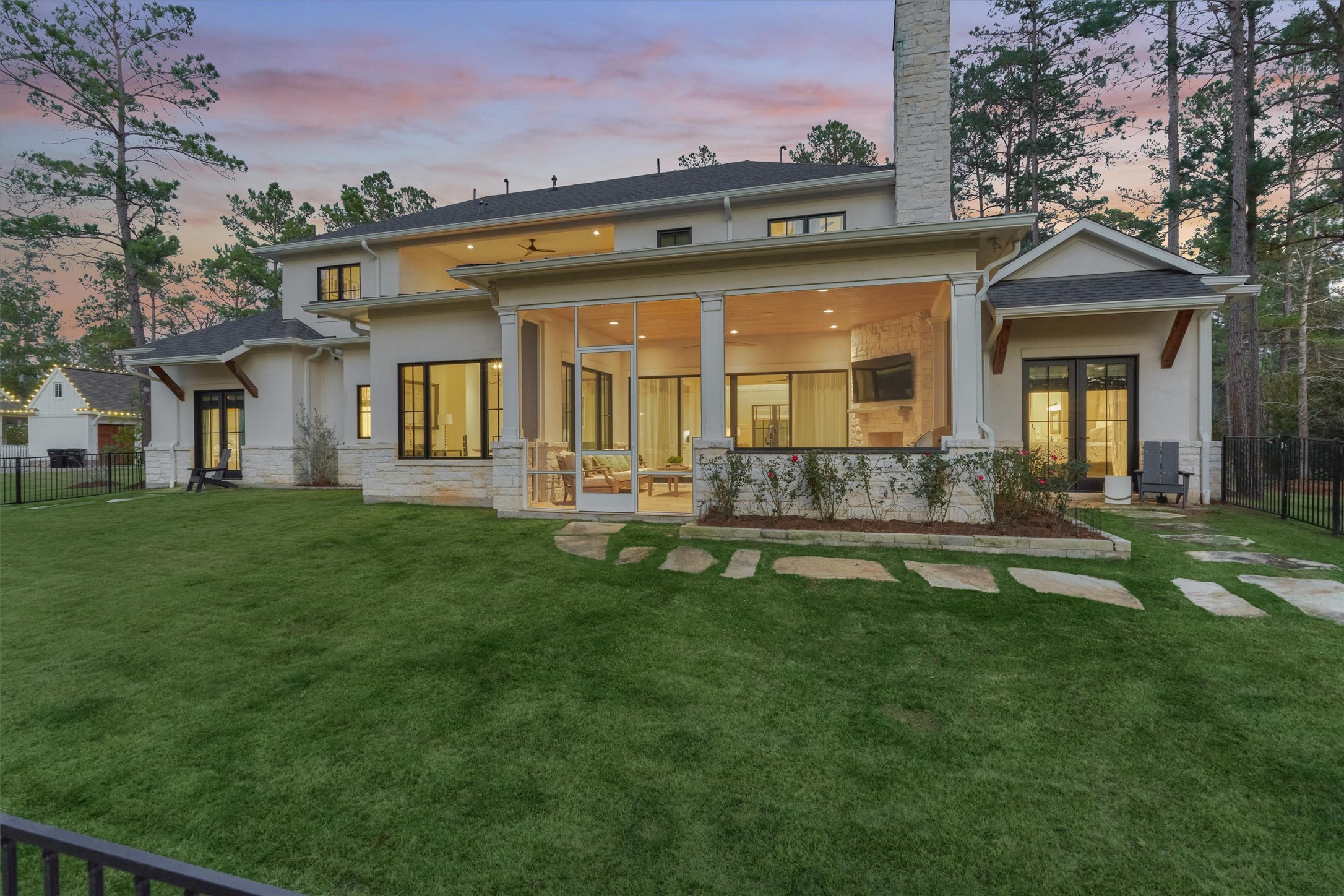 4469 Lily Bean Road Montgomery, TX 77316 - Photo 7 of 50 a front view of a house with a garden and lake view