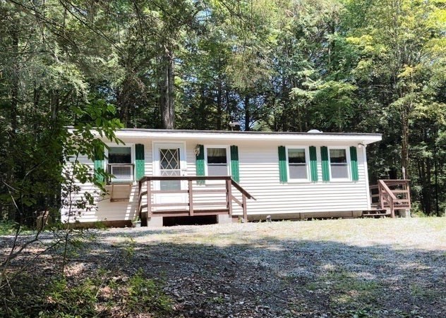 759 North Main Road, Unit V8J Otis, MA 01253 - Photo 21 of 21 a front view of a house with a yard