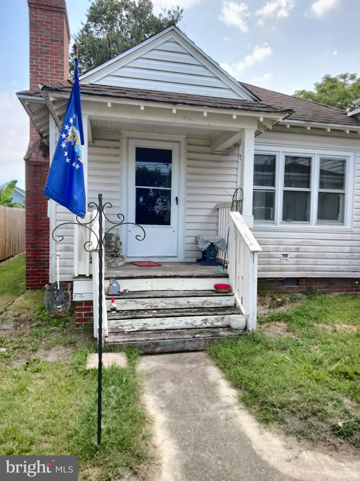 7411 Main Street Willards, MD 21874 - Photo 27 of 43 a front view of a house with a yard
