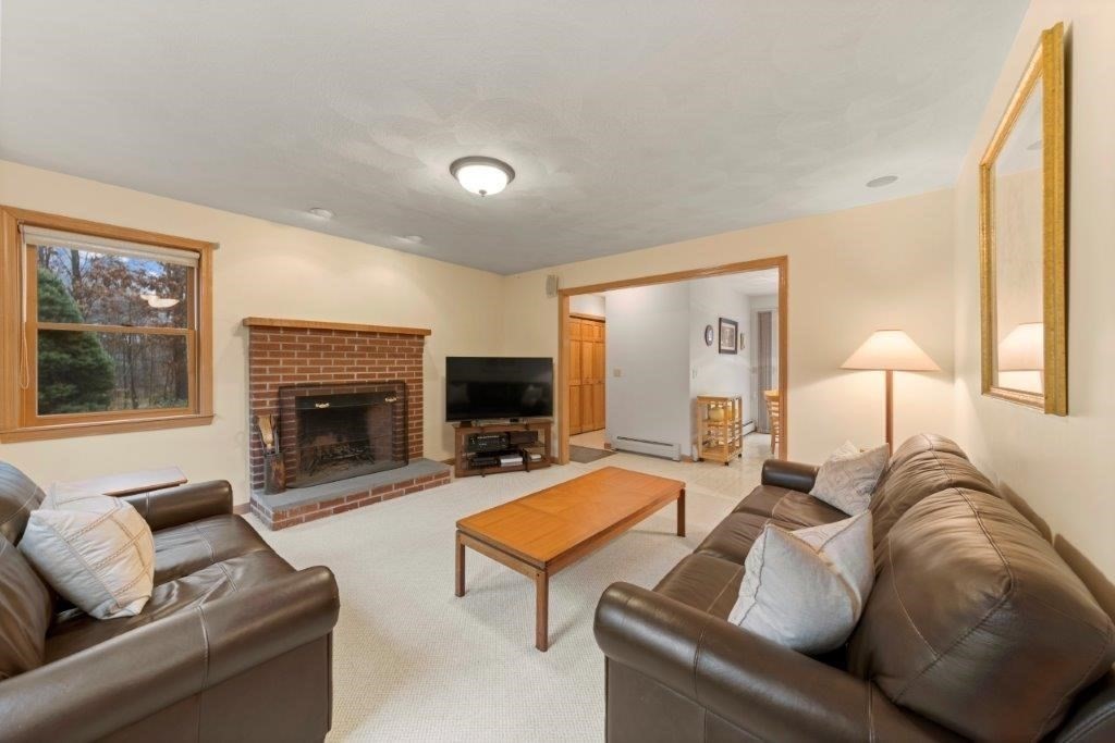 16 Stagecoach Road Princeton, MA 01541 - Photo 17 of 40 a living room with furniture and a fireplace