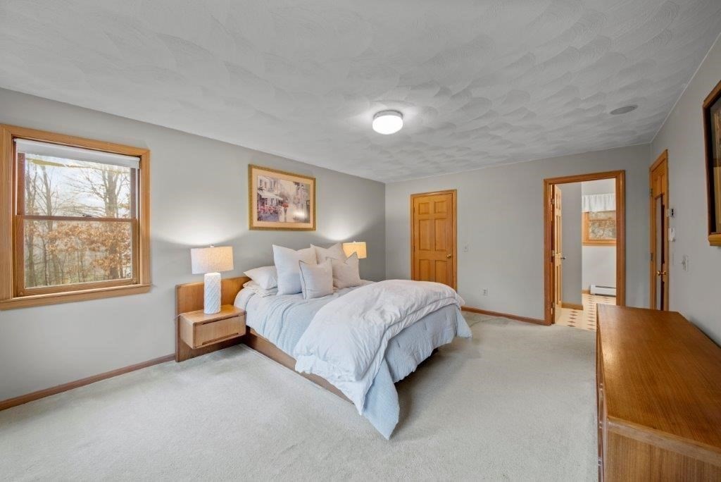 16 Stagecoach Road Princeton, MA 01541 - Photo 23 of 40 a living room with a bed furniture and next to a window