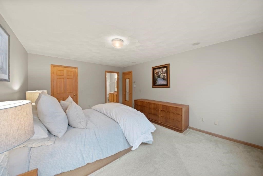 16 Stagecoach Road Princeton, MA 01541 - Photo 24 of 40 a spacious bedroom with a bed and a couch