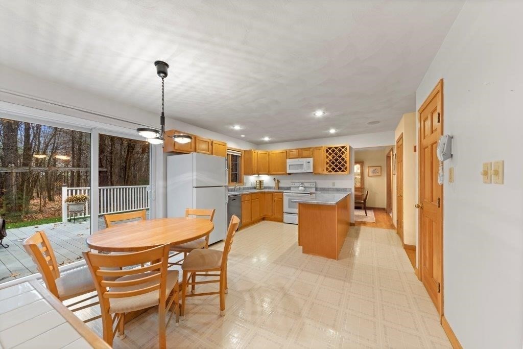 16 Stagecoach Road Princeton, MA 01541 - Photo 8 of 40 a dining room with furniture and a floor to ceiling window