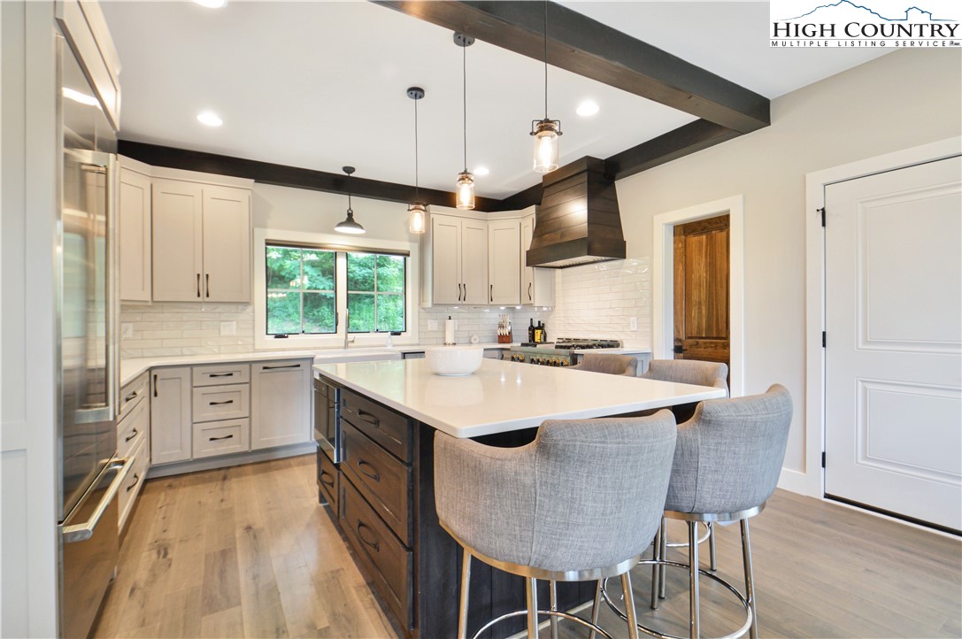 1736 Twin Rivers Drive Boone, NC 28607 - Photo 11 of 46 a large kitchen with kitchen island a large island in it