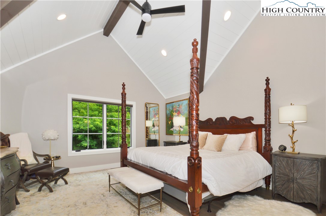 1736 Twin Rivers Drive Boone, NC 28607 - Photo 26 of 46 a large bed sitting in a bedroom next to a window