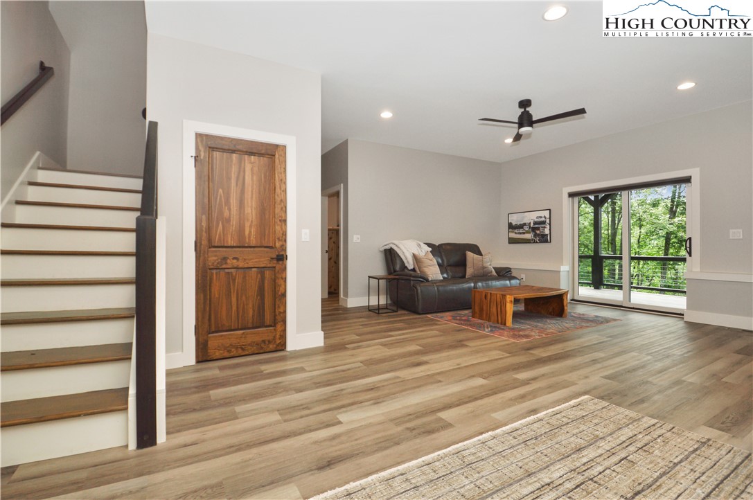 1736 Twin Rivers Drive Boone, NC 28607 - Photo 28 of 46 a living room with furniture a ceiling fan and a rug