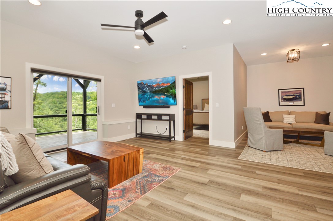 1736 Twin Rivers Drive Boone, NC 28607 - Photo 30 of 46 a living room with furniture and a large window