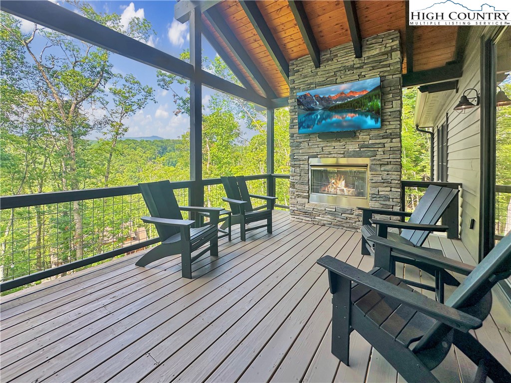 1736 Twin Rivers Drive Boone, NC 28607 - Photo 3 of 46 a view of a chairs and table in the balcony