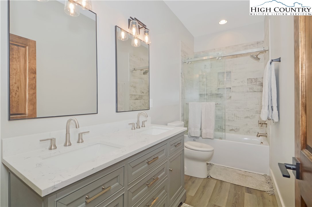 1736 Twin Rivers Drive Boone, NC 28607 - Photo 34 of 46 a bathroom with a sink a toilet and shower