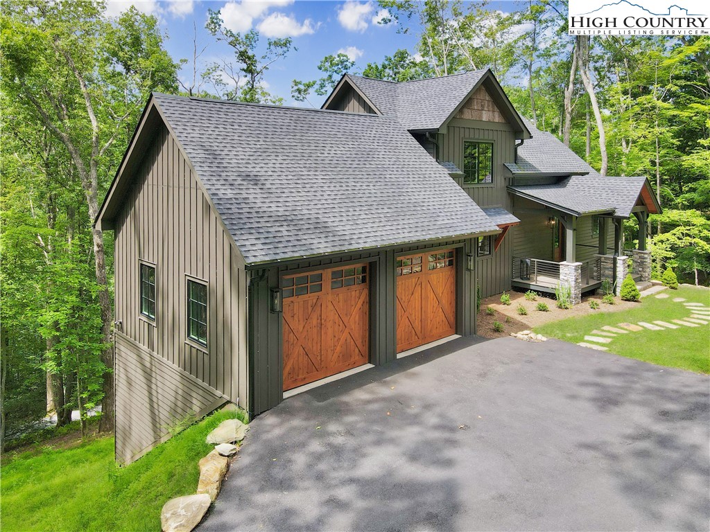 1736 Twin Rivers Drive Boone, NC 28607 - Photo 39 of 46 a front view of a house with garden